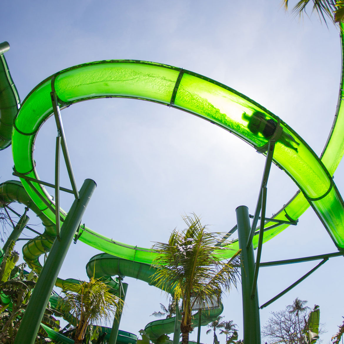 Rider dropping into the Double Twist trapdoor slide at Waterbom Bali