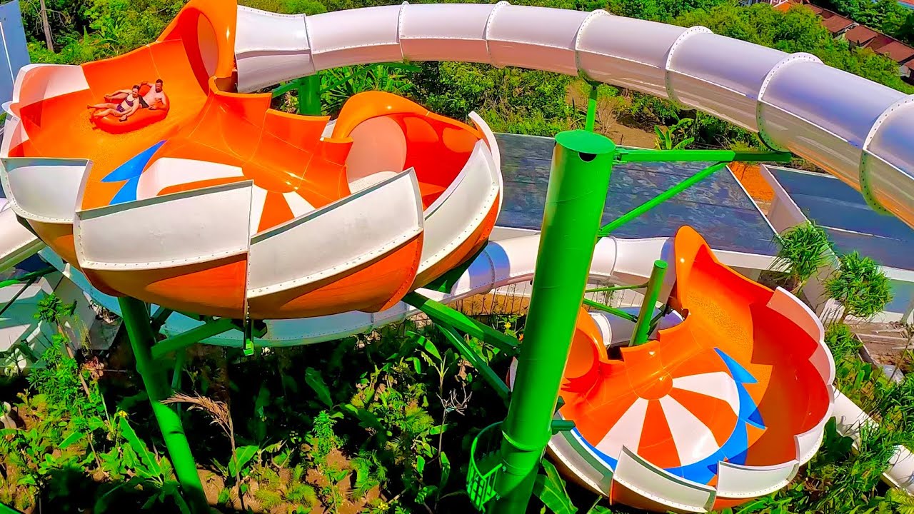 Riders spiraling through the Tailspin water slide at Waterbom Bali
